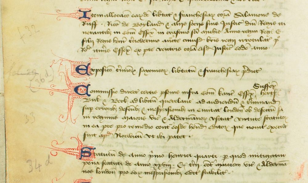 Manuscript page dating from about 1440, with lovely decorated capitals in blue with red filigree pattern; this is a table of contents for the rest of the manuscript. A twentieth-century hand has added, quite messily, pencil notations of which folios the specific entries can be found below.