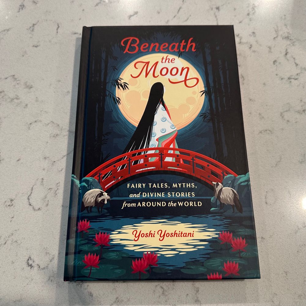 A copy of Yoshi Yoshitani’s book, “Beneath the Moon: FAIRY TALES, MYTHS, and DIVINE STORIES from AROUND the WORLD”