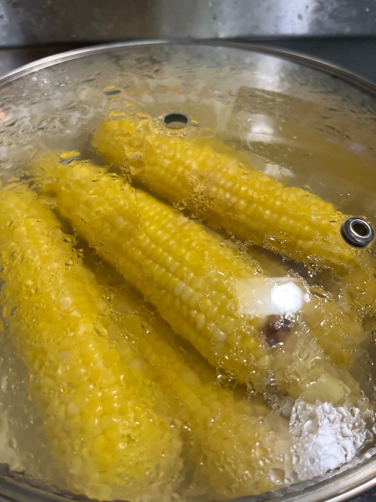 a pot full of corn that was boiled