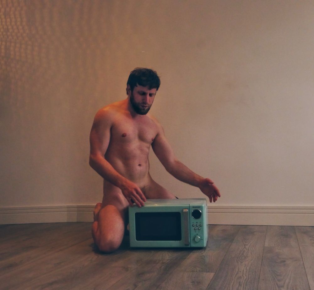 Boy showing microwave