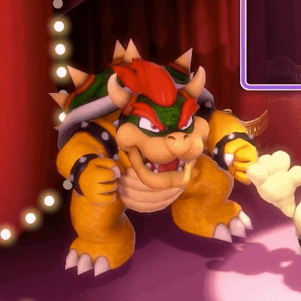 a cartoon character bowser is standing on a stage with a red curtain behind him