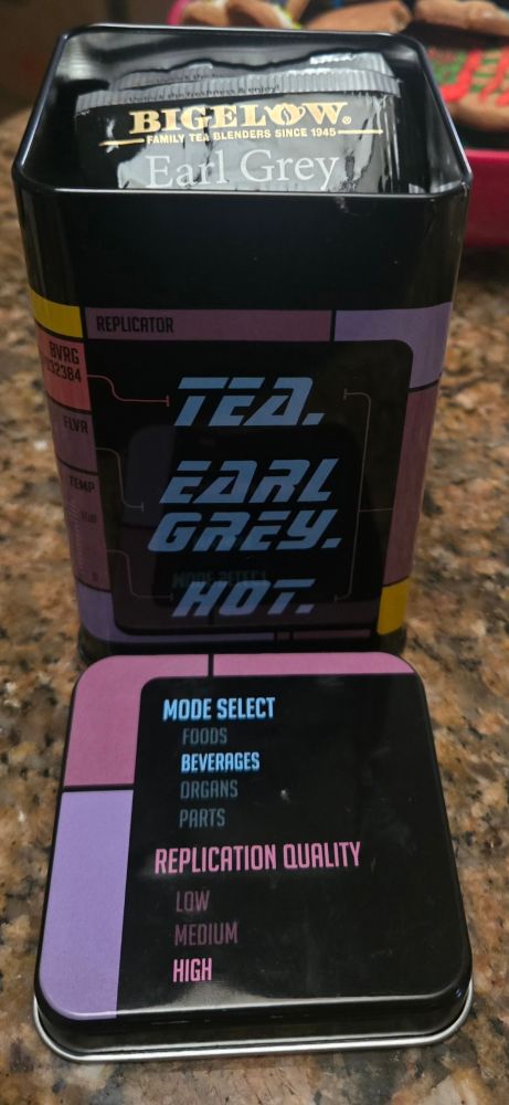 Tea tin that has Star Trek LCARS.
It says "Tea. Earl grey. Hot" other words make it look like a replicator interface.
Inside the tin is Biglow Earl Grey Tea packages.