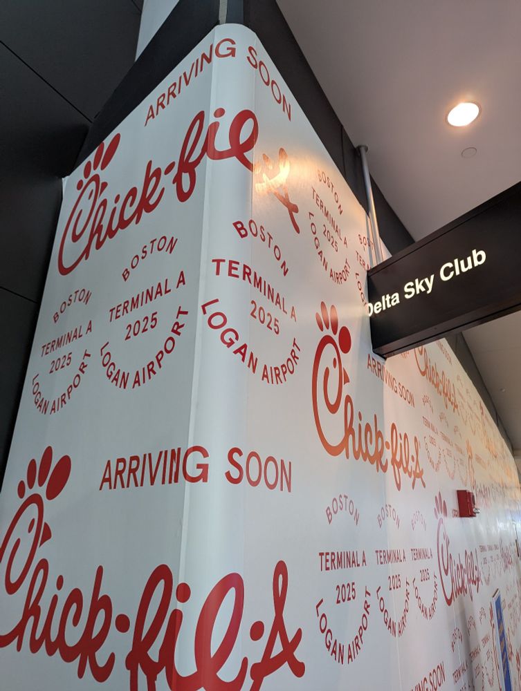 "Delta Sky Club" sign cut off by Chick-fil-a construction paper