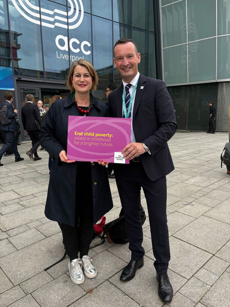 Mark with Helen Hayes MP and a sign saying end child poverty