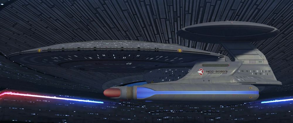 A side view showing the Nebula class with the Phoenix sensor pod and a standard Nebula center pylon.