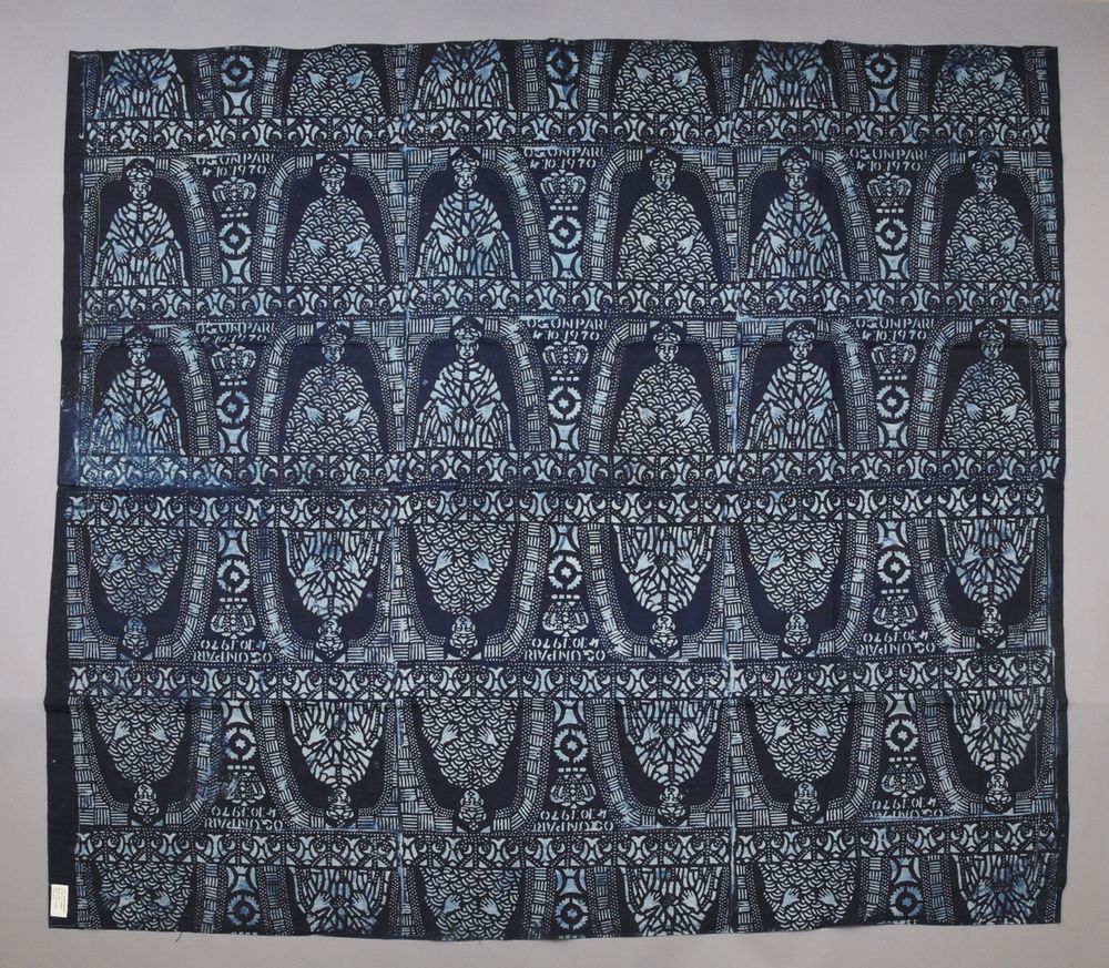 Textile with intricate design in light and dark blues.
