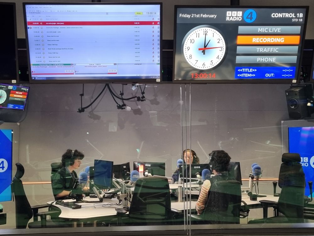 3 people in headphones in radio studio