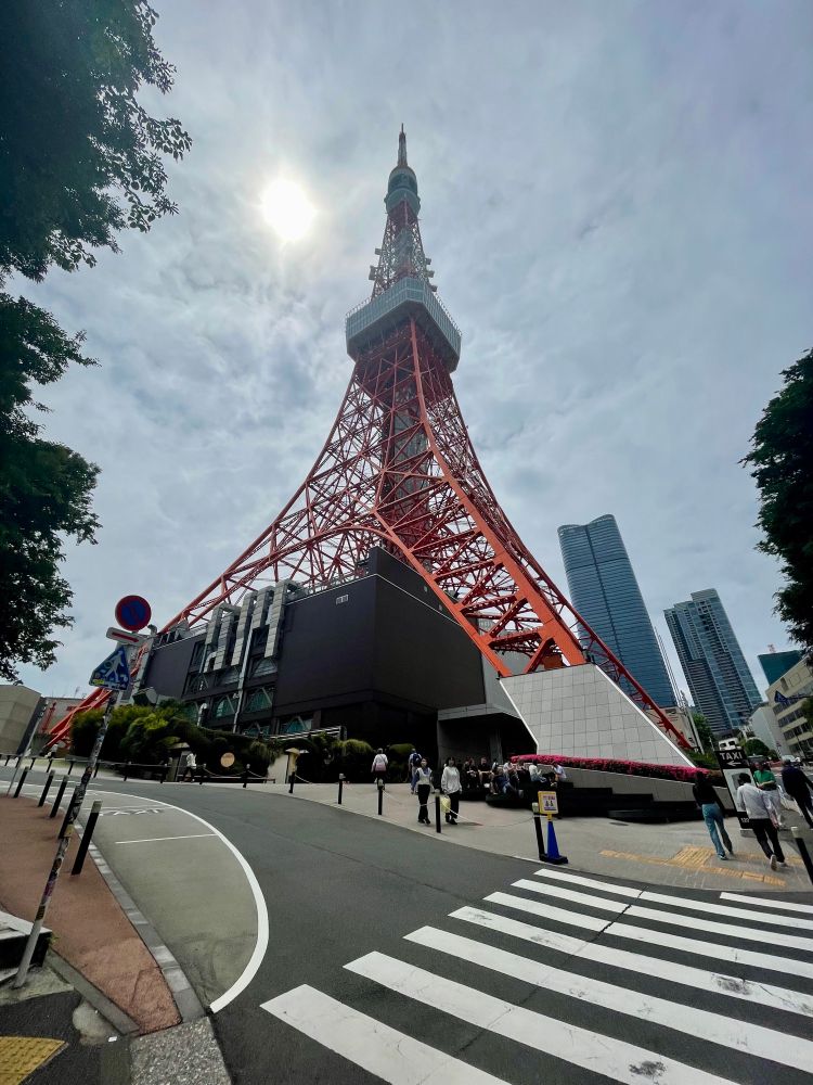 A view of Tokyo Tower from the bottom looking up.