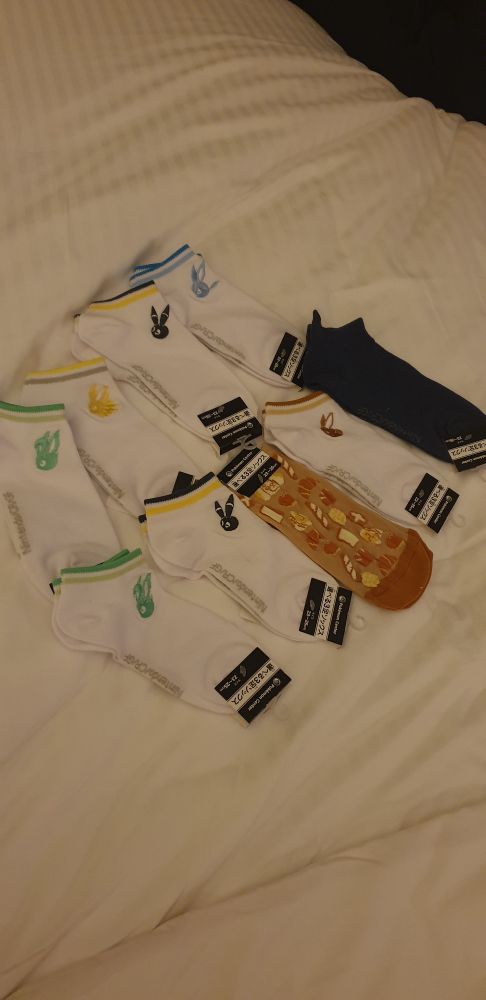 A photo of 9 pairs of Pokemon themed socks