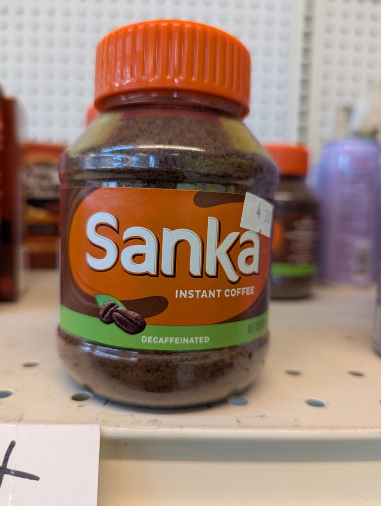 A container of Sanka instant decaffeinated coffee.