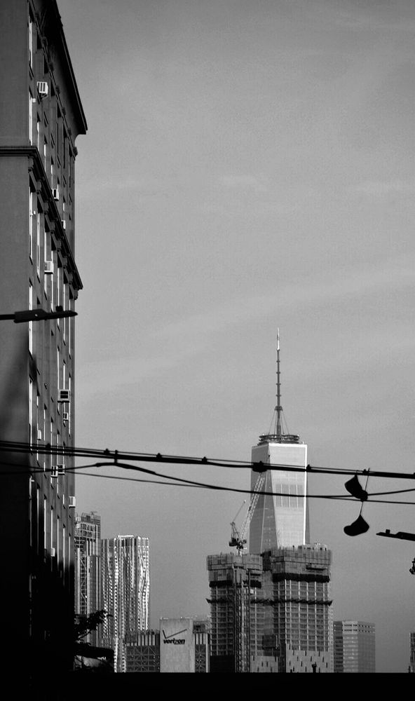 World Trade Center with sneakers hanging over a power line.