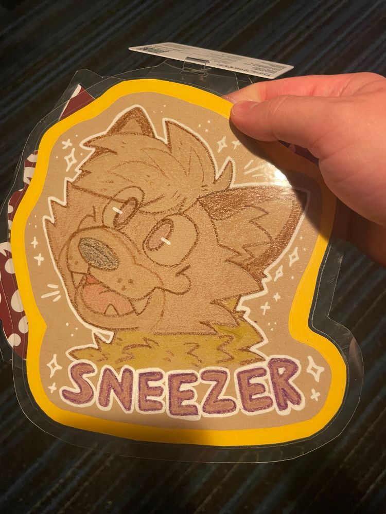 Crayon drawing badge of my character “sneezer”