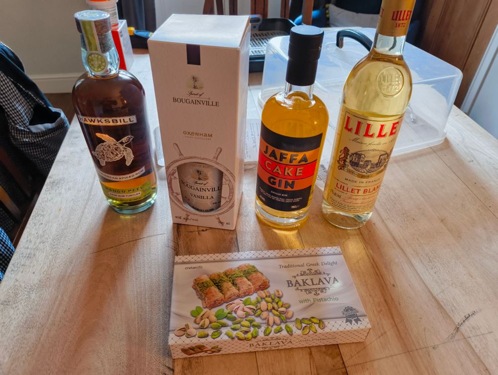 A selection of fruit based rums and gins, and some baclava. Booze for'bairn.