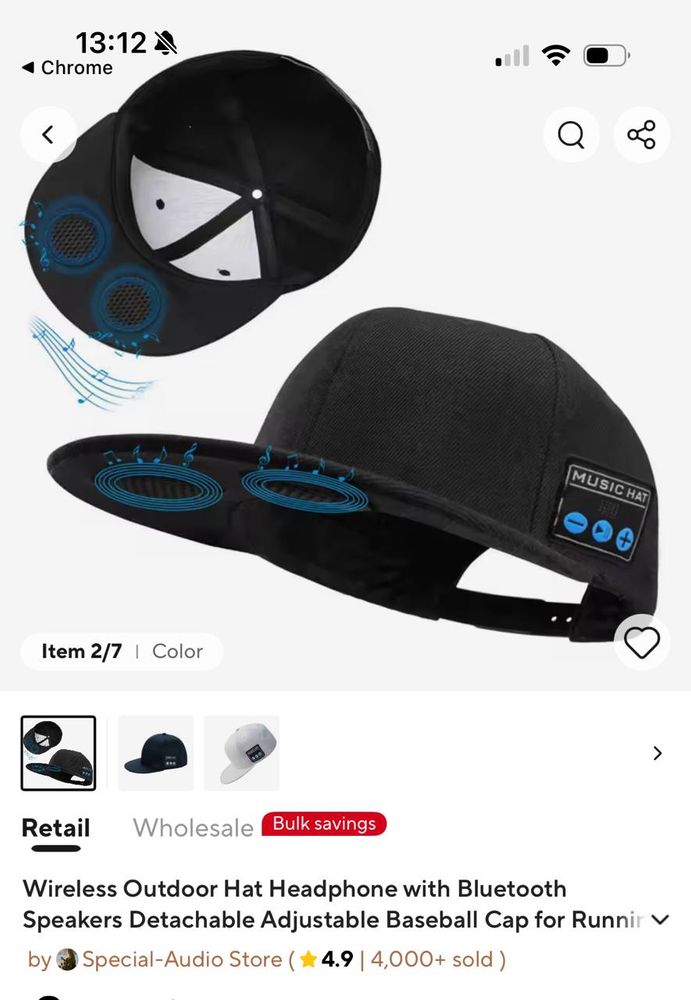 a screengrab of a product page showing a baseball cap with headphones built into the brim of the cap.
