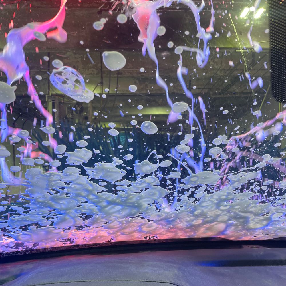 splatters of soap on a windshield 