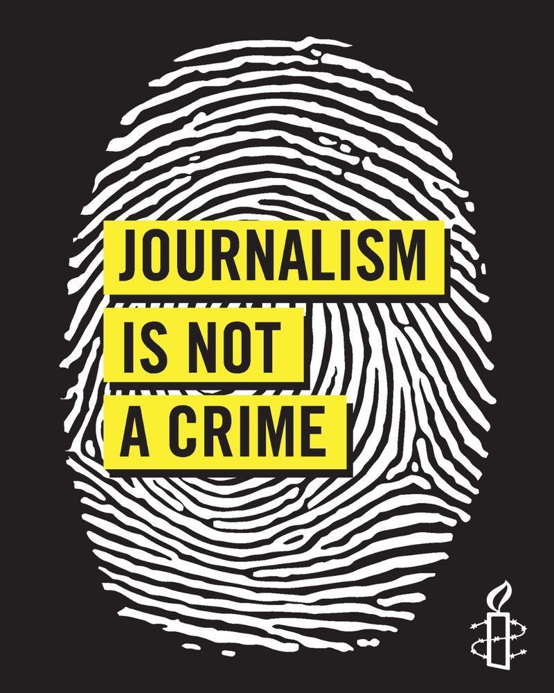 Finger print with 'journalism is not a crime' written over. 