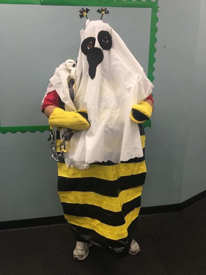Picture of a man wearing a bee costume, but also a ghost. A Boo Bee if you will. 