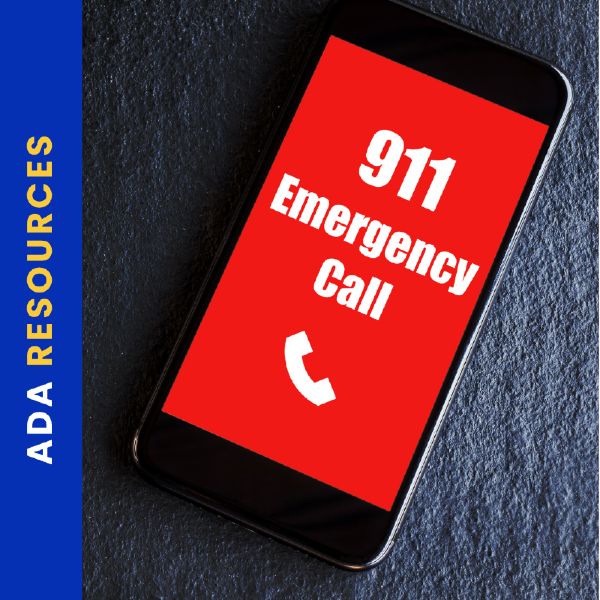A smartphone lies on a dark surface with its screen displaying a bright red background and bold white text reading “911 Emergency Call” with a phone icon below. A vertical blue banner along the left side reads “ADA RESOURCES” in yellow and white text.

