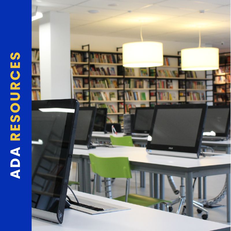 Modern library workspace with desktop computers on white tables, lime green chairs, and bookshelves in the background. A vertical blue banner on the left reads “ADA Resources” in bold yellow and white text.
