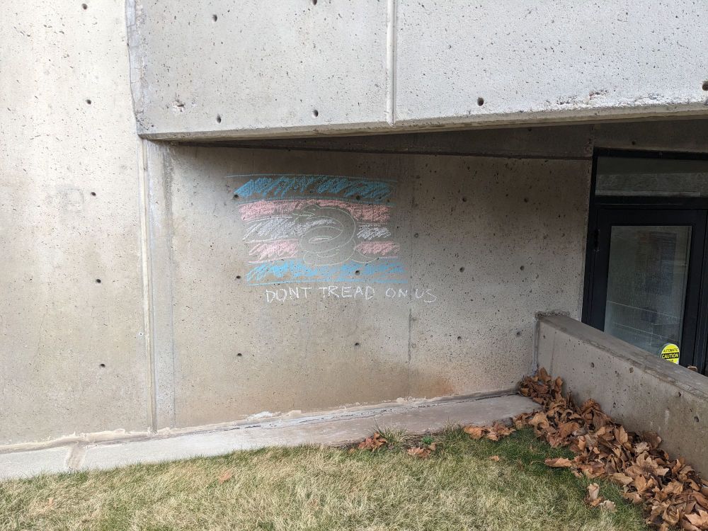Trans flag that says don't tread on us on U of U campus 