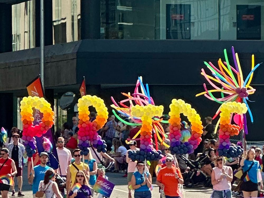 Big bunches of colourful balloons spelling out PRIDE 