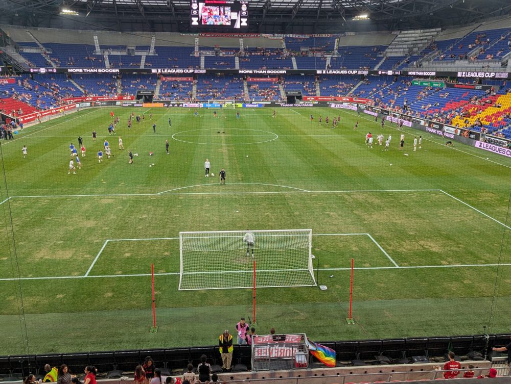 Photo of the field at Red Bull Arena ahead of tonight's Leagues Cup match. Big patches of brown, worn out grass in the 18-yard box by the South Ward. 