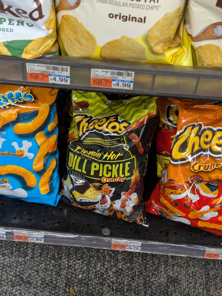 Lower on that same shelf, Flaming Hot Dill Pickle Cheetos. Just a coincidence? 