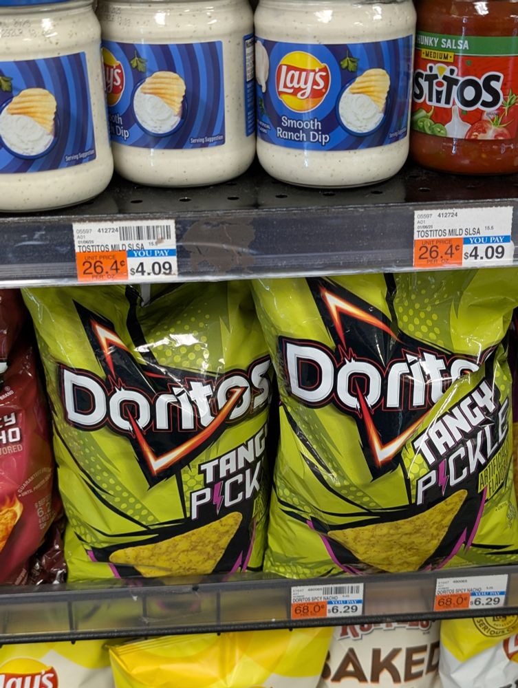 Spotted on a CVS shelf, "Tangy Pickle" flavor Doritos. On their own, harmless, but