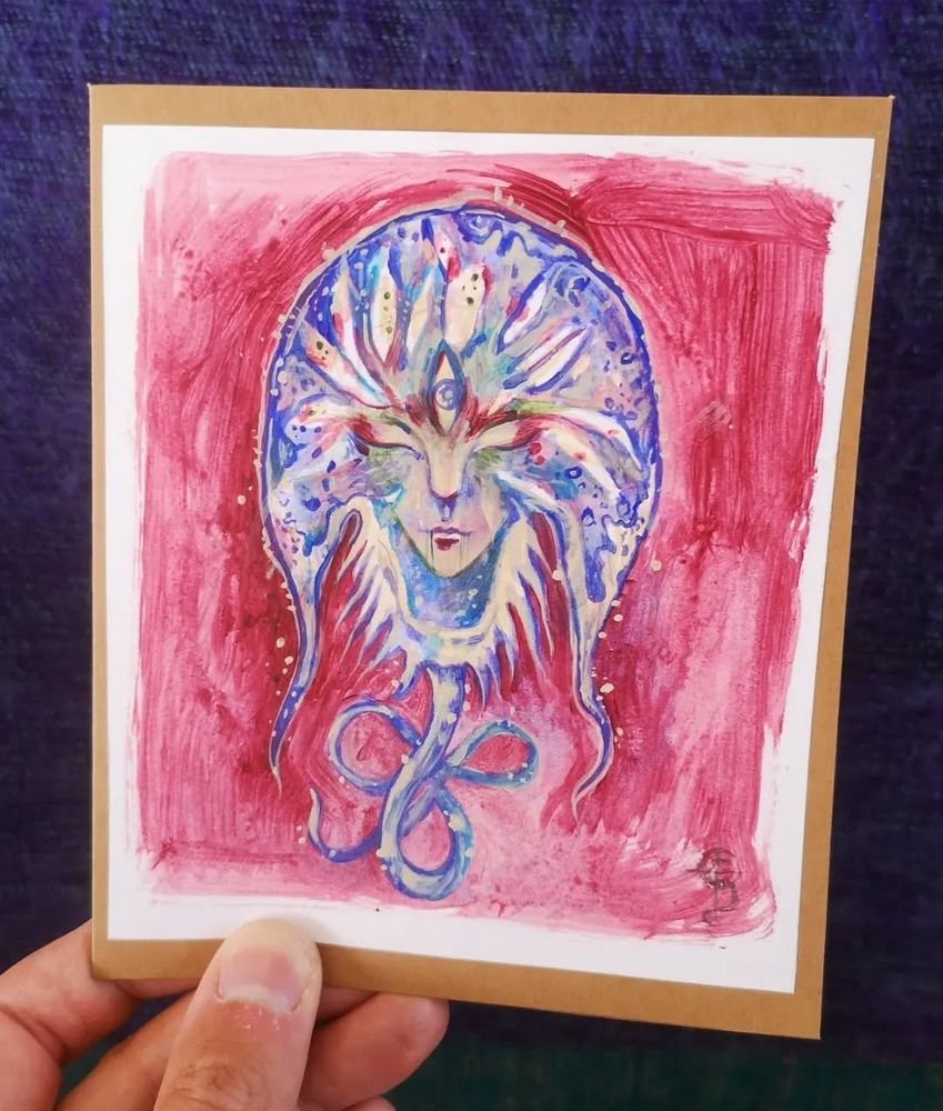 Handpainted card of a fantasy style face in a horseshoe crab shape