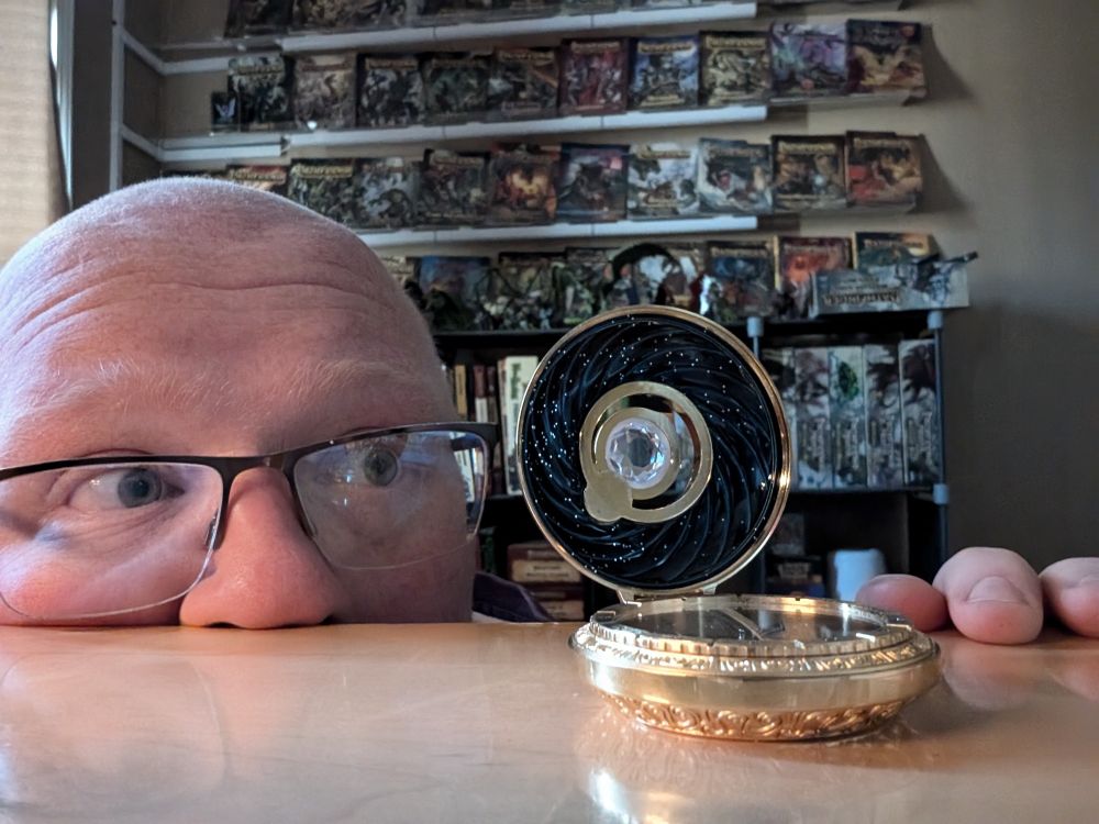 Top half of my face looking at a way finder compass with awe