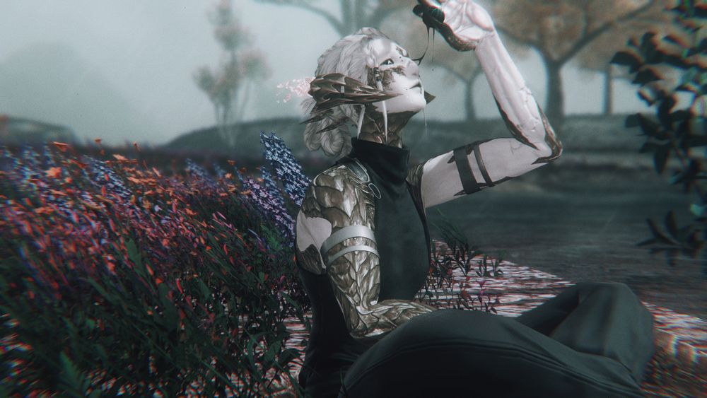 a zoomed out image to show cyma (an au ra of marble body and golden scales) sitting on a riverbank in kozama'uka, bright flowers, trees and grasses behind them even amidst the midday torrential rains. they hold one hand up, the eye given by zero pulled from their broken socket casually, held aloft as if to get a better view, trails of black blood just breaking as they stretch between eye and socket. cyma looks serene, dressed simply and alone on the bank