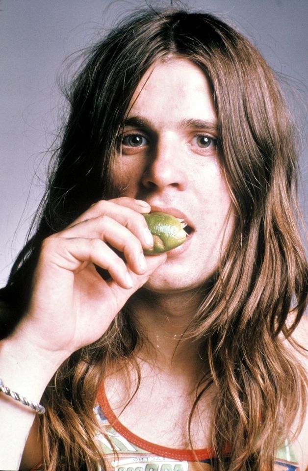 Ozzy Osborne sucking on a lime circa 1972.