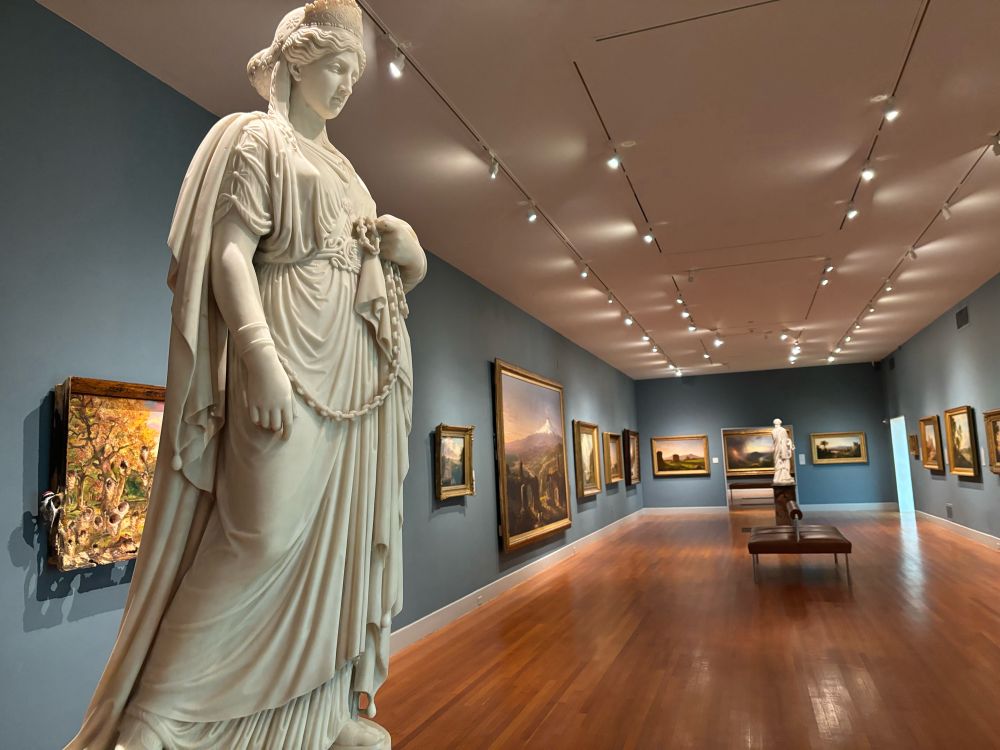 Harriet Hosmer’s sculpture Zenobia in Chains in a gallery full of Hudson River School art in the Wadsworth Atheneum in Hartford.