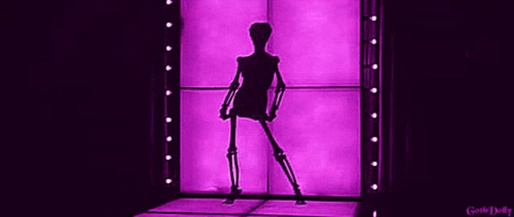 a skeleton is dancing in front of a purple wall with lights .