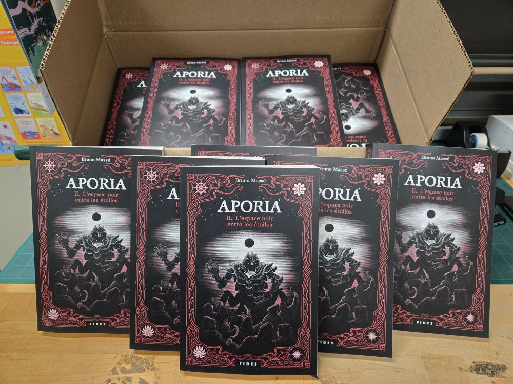 Pile of gothic books with a black and red cover featuring a monster
