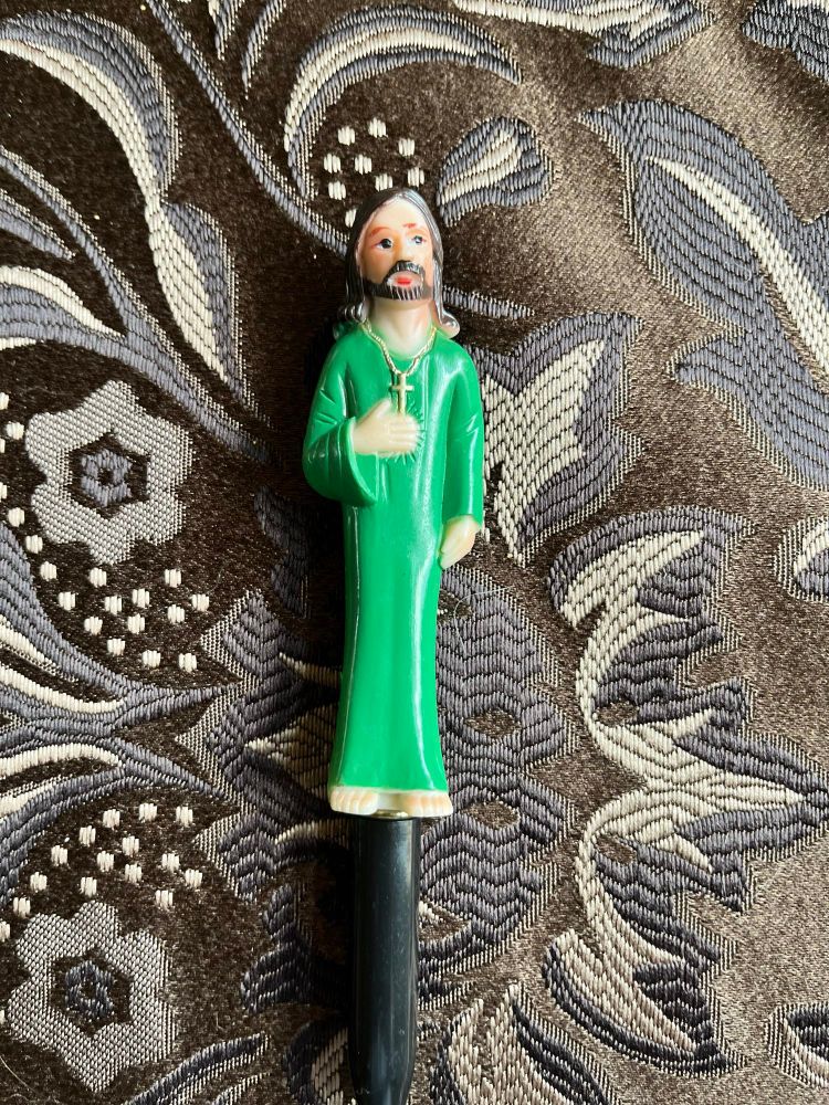 A little Jesus wearing a cross (?!?)