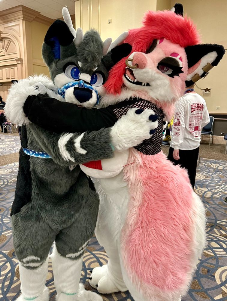 Fursuit photo of Val with Jenga.