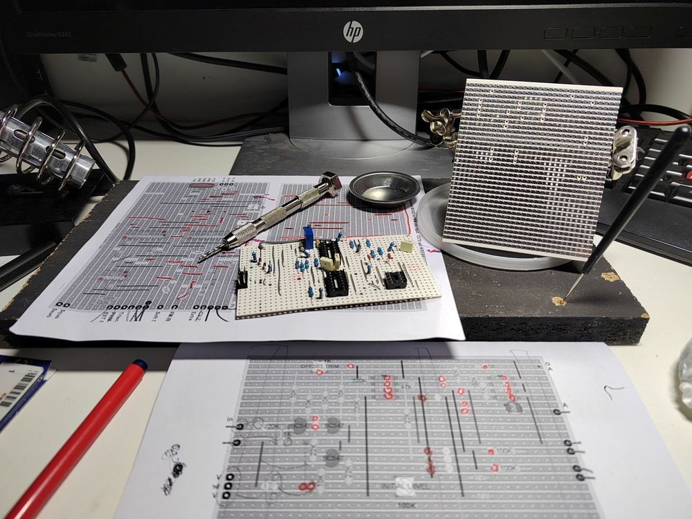 Two stripboards in a workbench during soldering of the components. 