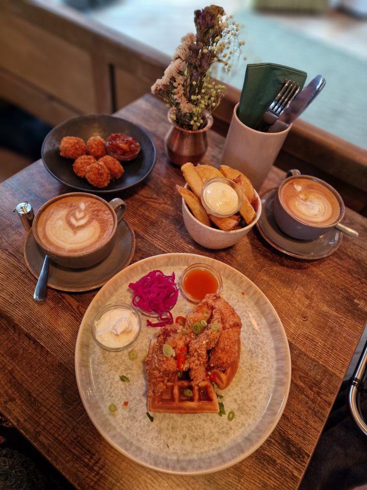 Feta & Polenta Balls, chuncky chips, chicken & waffles, 2 cups of Cappuccino