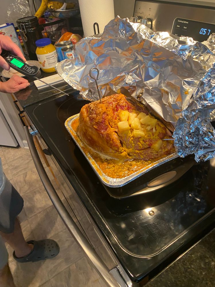 A ham in the process of being cooked