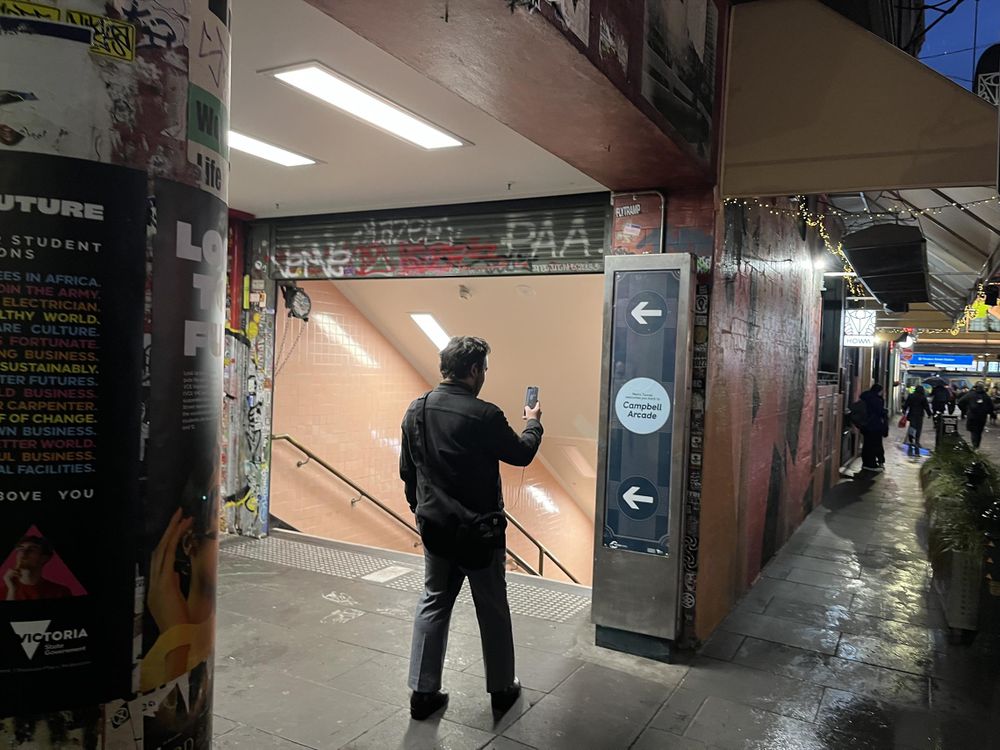 Entrance to Campbell Arcade. A person is taking a photo