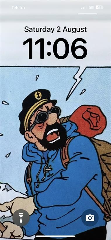 IPhone wallpaper with Captain Haddock from Tintin, placed so the clock looks like it is in a speech bubble