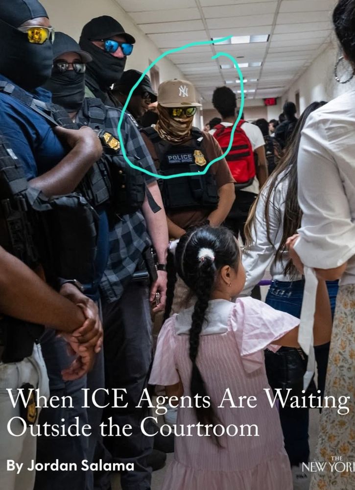 ICE agent wearing a Yankee ball cap