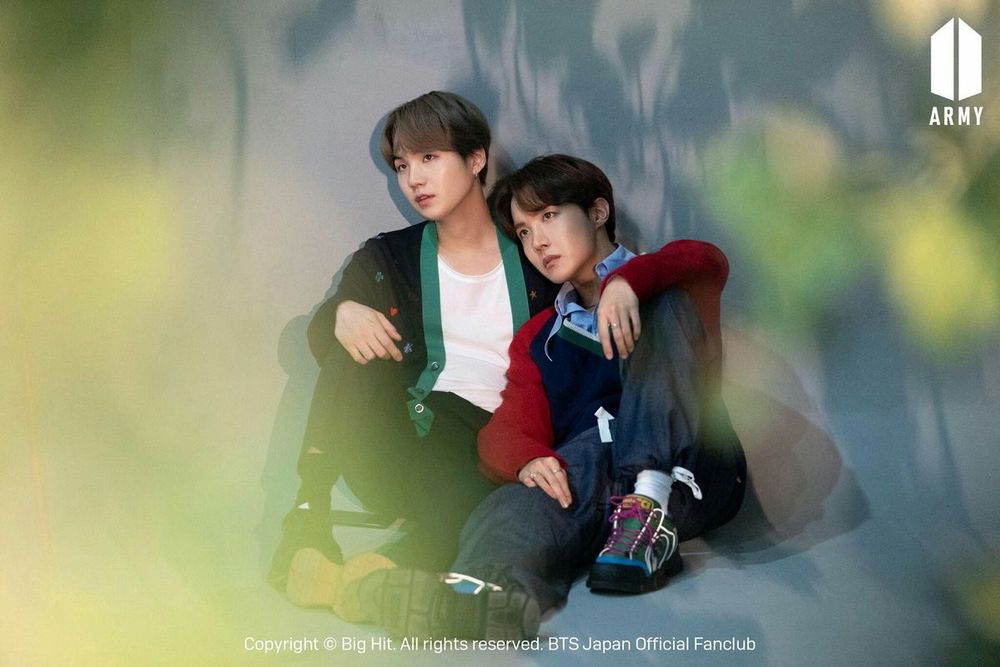 Suga and j-hope cuddled up posing for a photoshoot for the Japanese army fan membership
