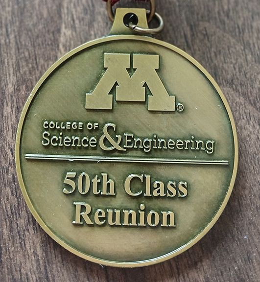 Medallion saying "College of Science and Engineering, 50th Class Reunion" 