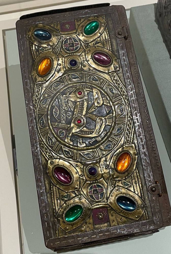 Object from the American Arts & Crafts Museum with various colored glass beads embedded