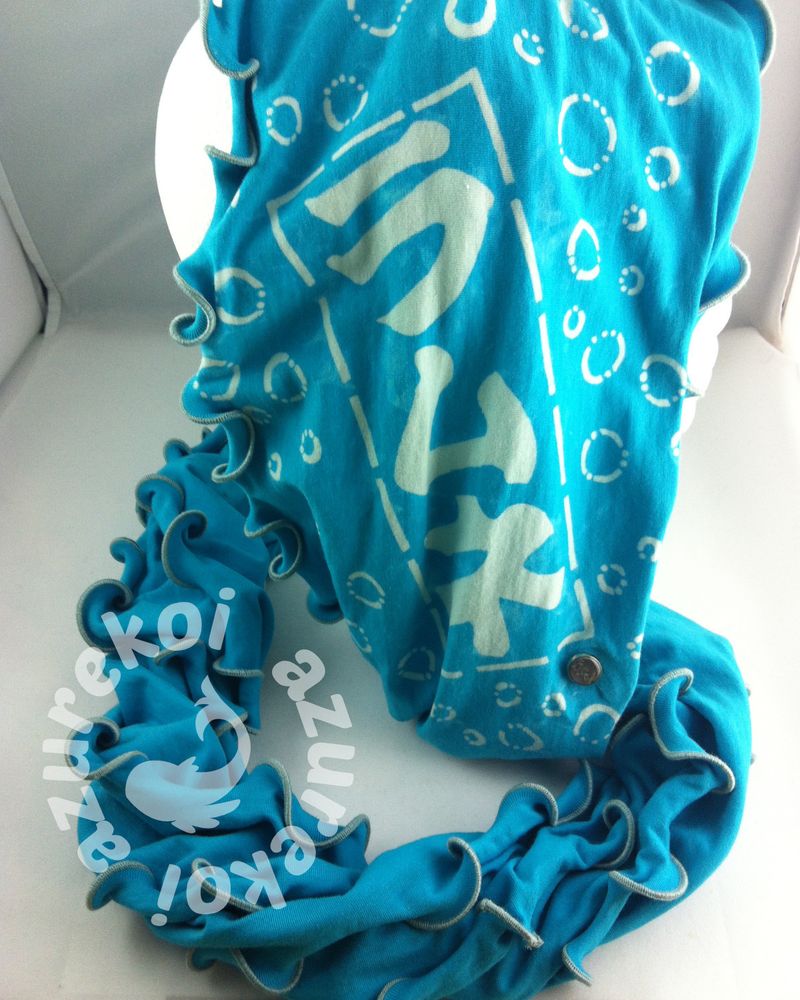 ramune printed in Japanese on teal rayon fabric with a cool rolled edge that looks like octopus suction cups