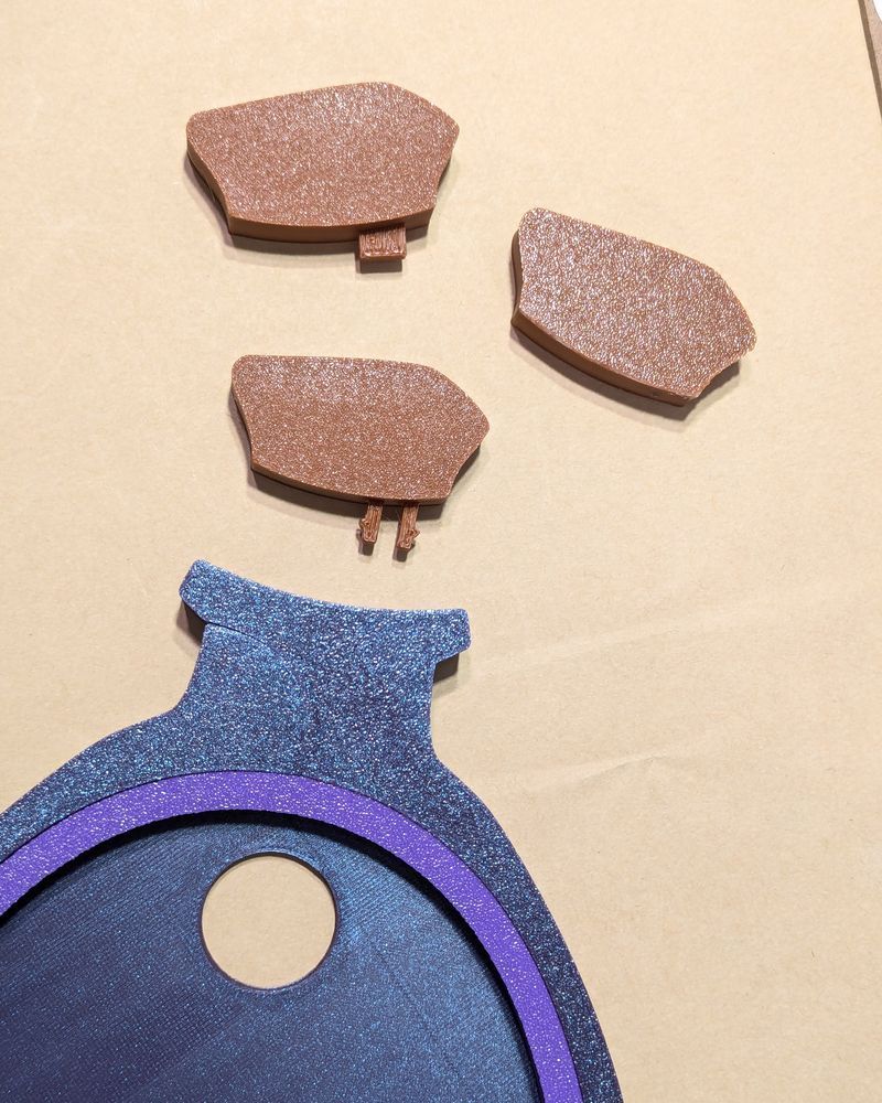 three different cork attachment attempts for the potion embroidery hoop