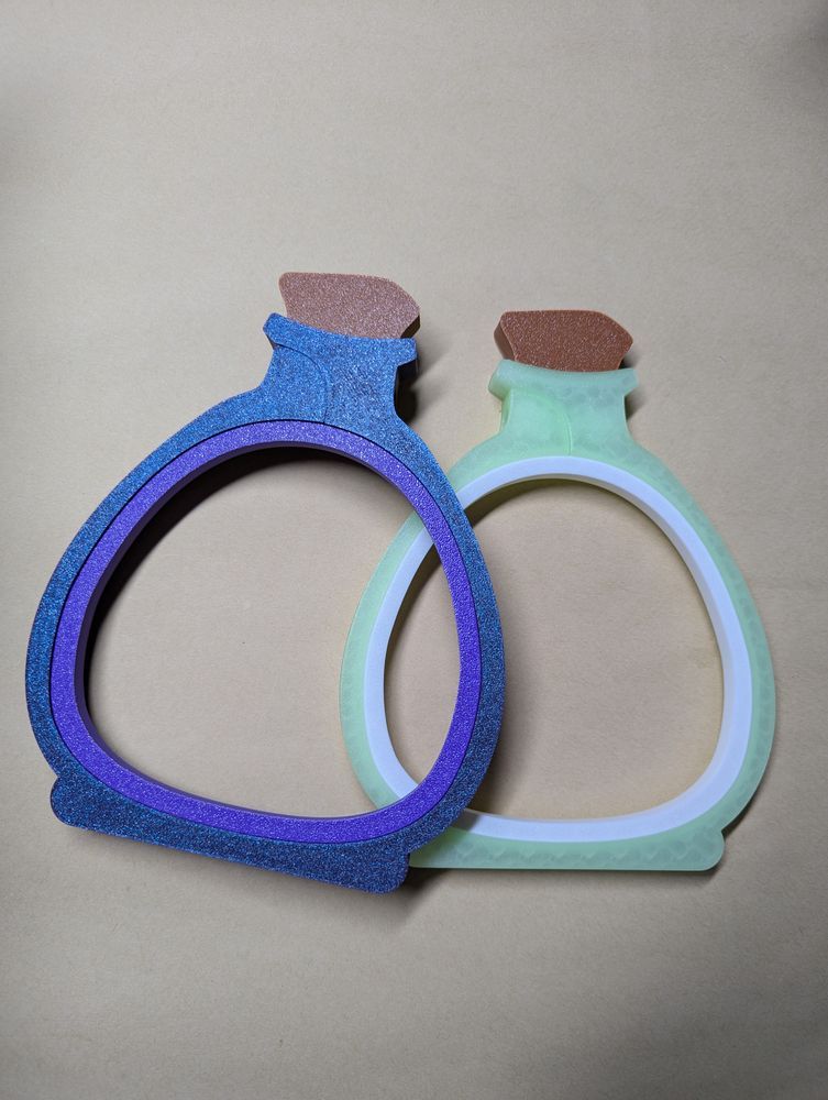 purple glitter potion embroidery hoop and glow in the dark green embroidery hoop 