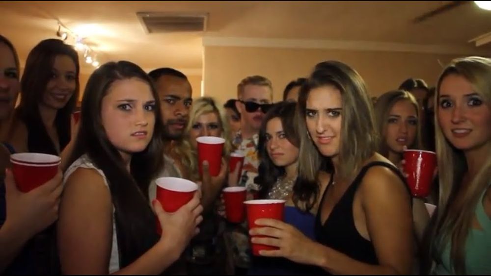 Meme of everyone staring at you at a party holding red solo cups and scowling 